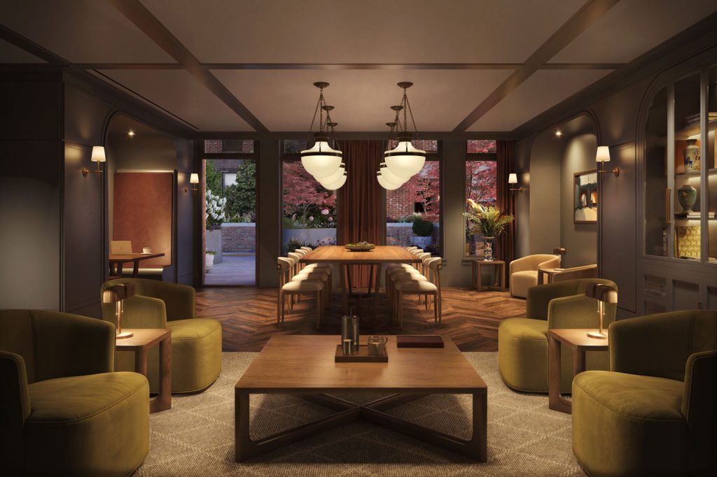 Co-working space at The Village West luxury homes in New York with large meeting table, private booths and lounge seating.