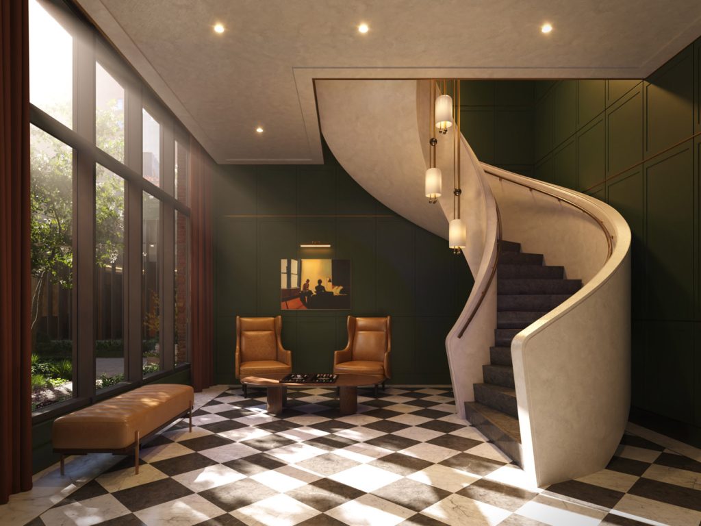 Spiral staircase at the back of the lobby at The Village West ascending to the second floor lounge and entertainment spaces.